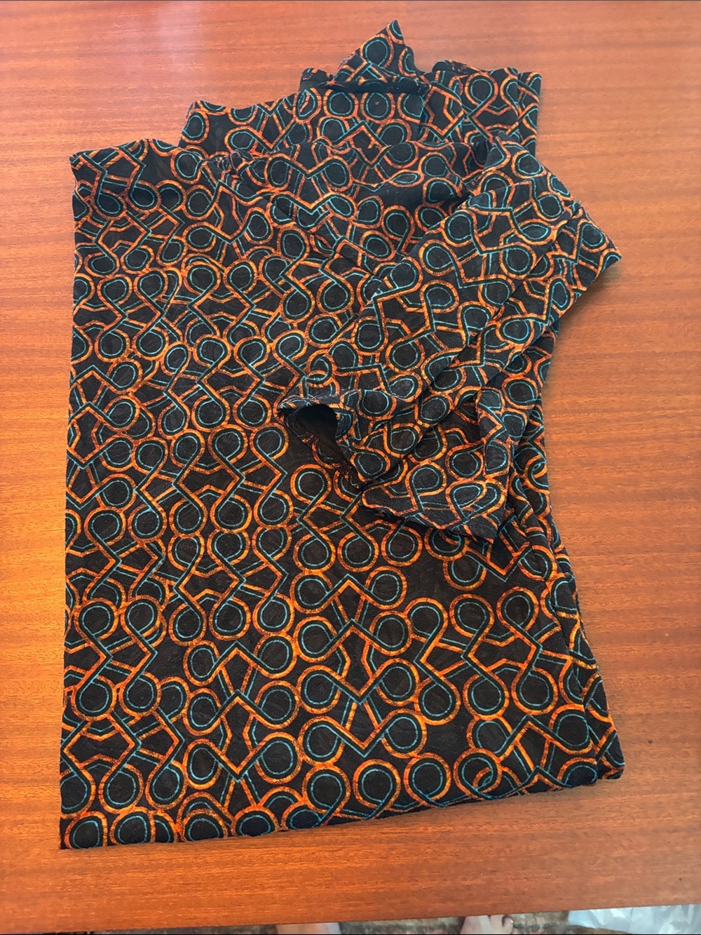 LuLaRoe Black Top with Orange & Teal Geometric Design